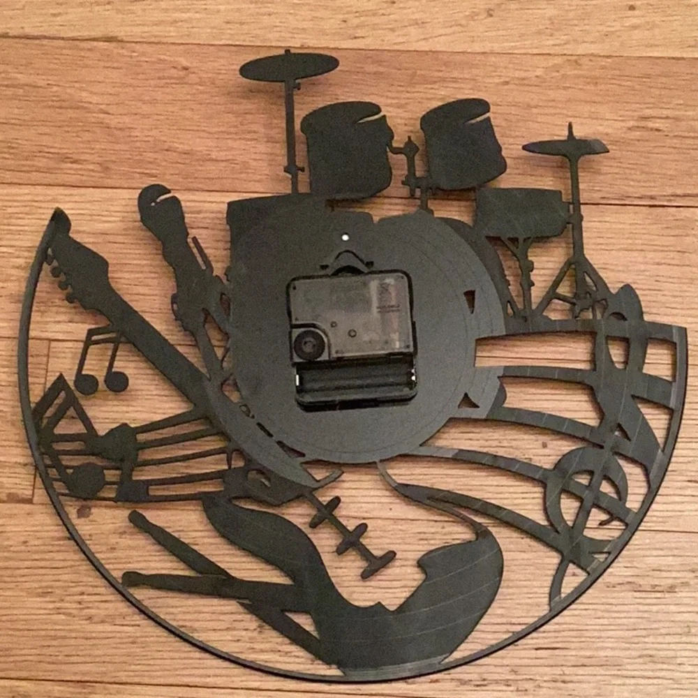 Kinglive battery operated musical montage clock in black and white white. 12”.